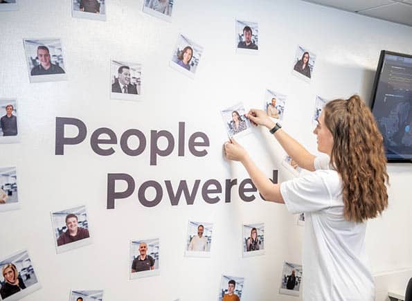 Payten placing a magnet onto our "People Powered" SEP2 wall