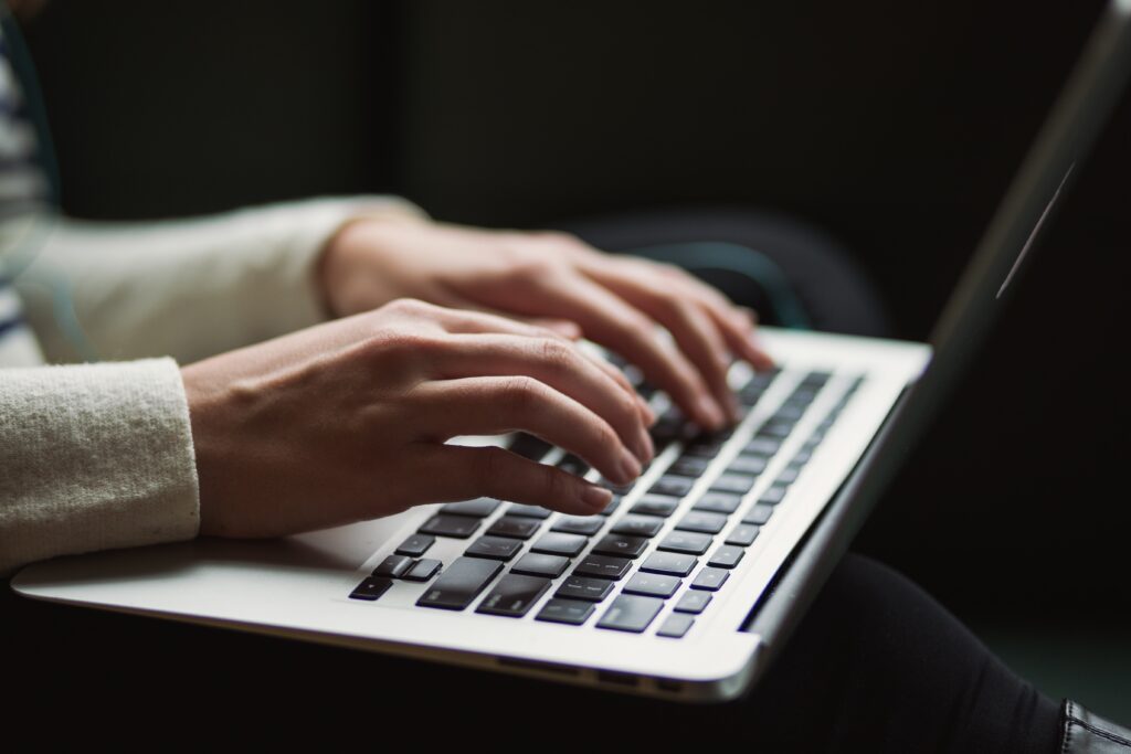 Typing on laptop