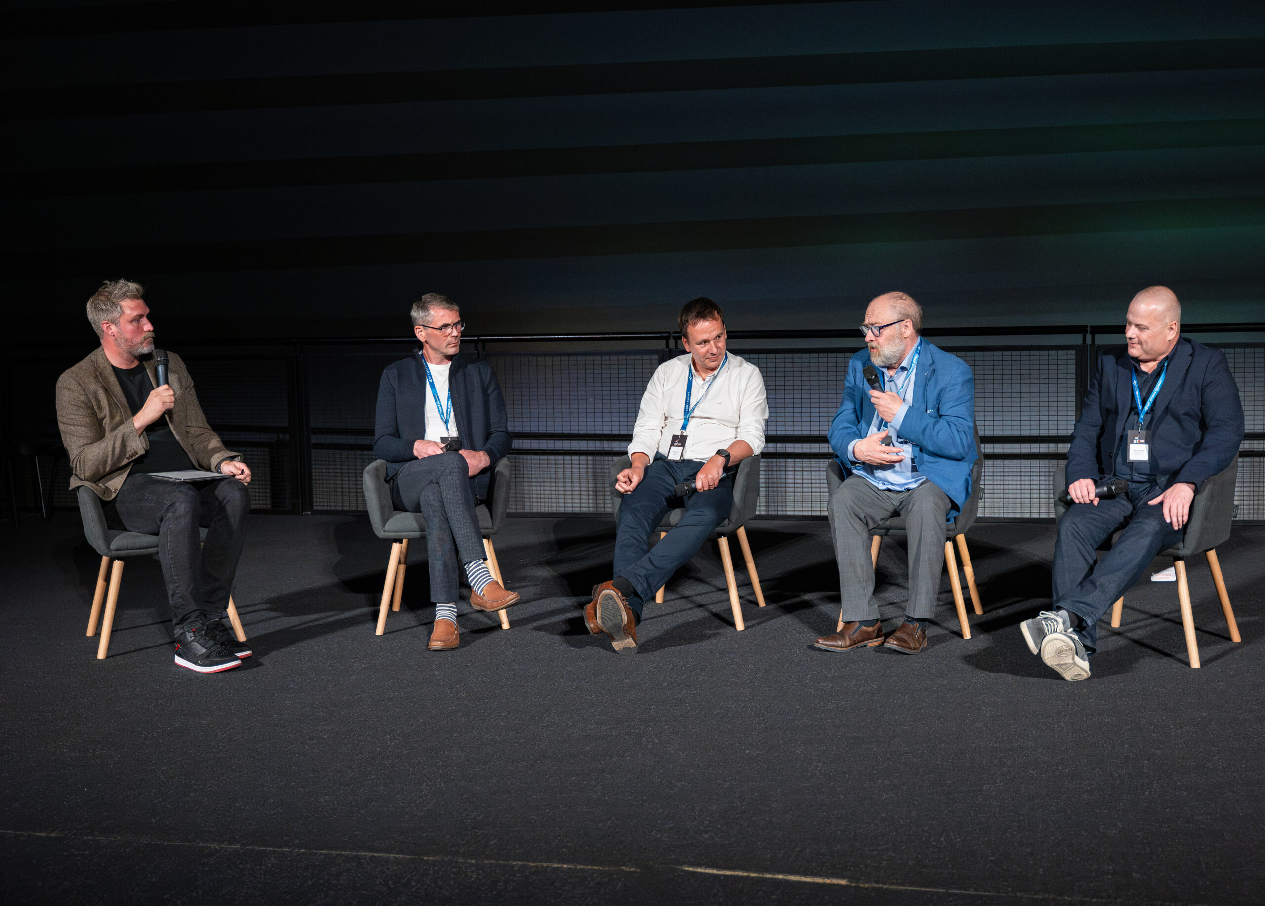 Five people sat in chairs on stage discussing cyber security concerns at SEP2 Cyber Summit 2025 at the London Science Museum
